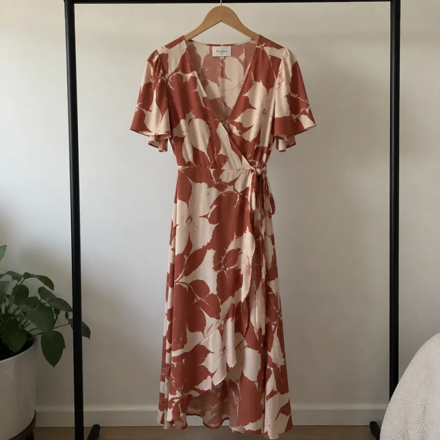 Phone photo of a fictional printed dress on a rail